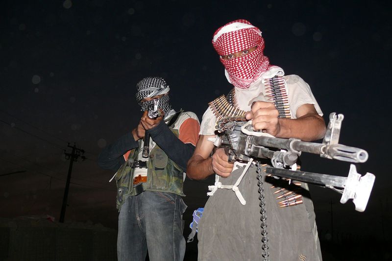 Iraqi_insurgents_with_guns_2006.0